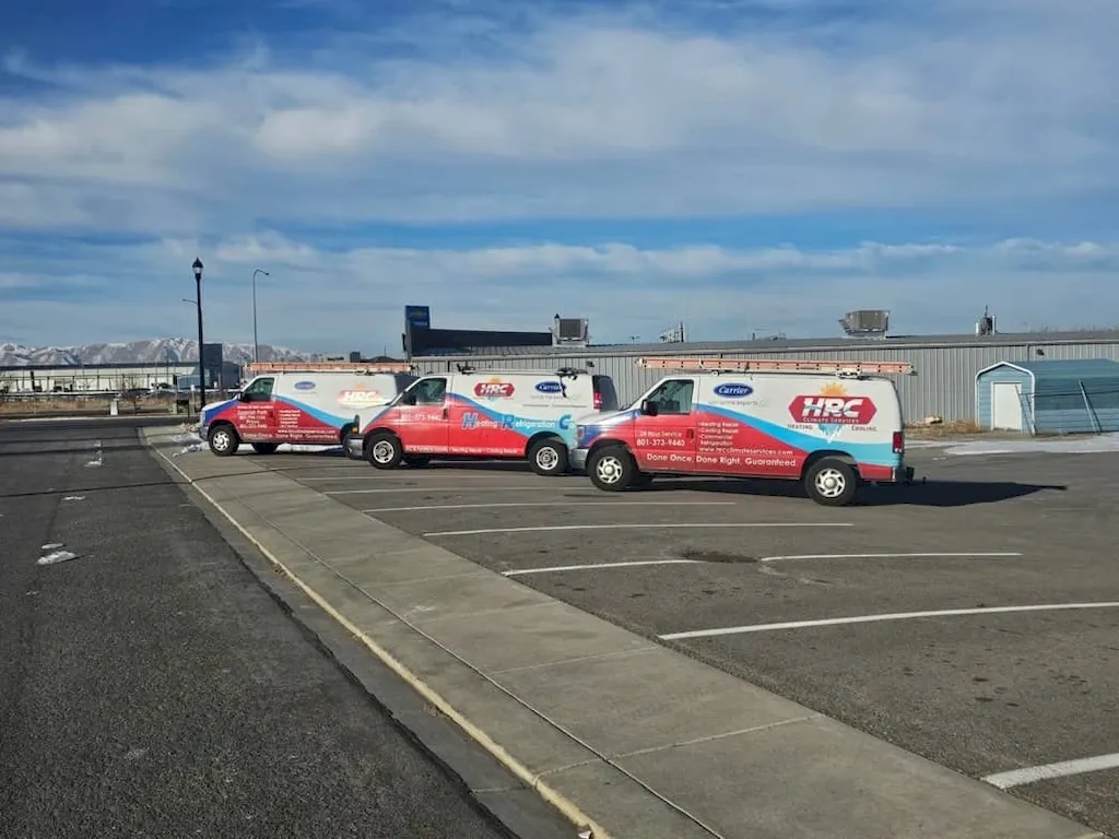 HRC Climate Services vans parked in a row